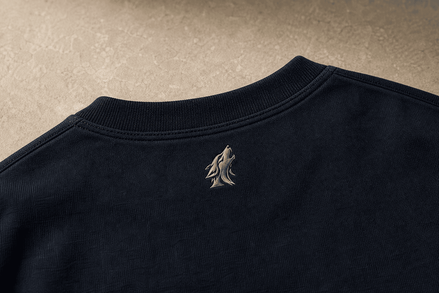 Close-up of the DYRWOLF Navy T-Shirt back collar mark