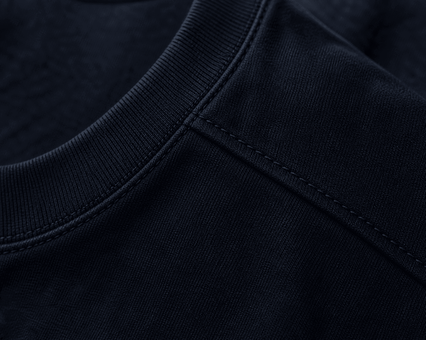 Macro detail of the DYRWOLF Navy T-Shirt fabric and stitching