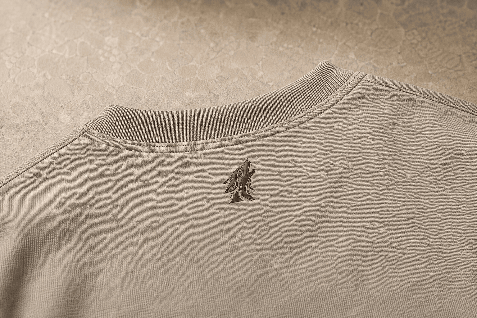Close-up of the DYRWOLF Stone T-Shirt back collar mark