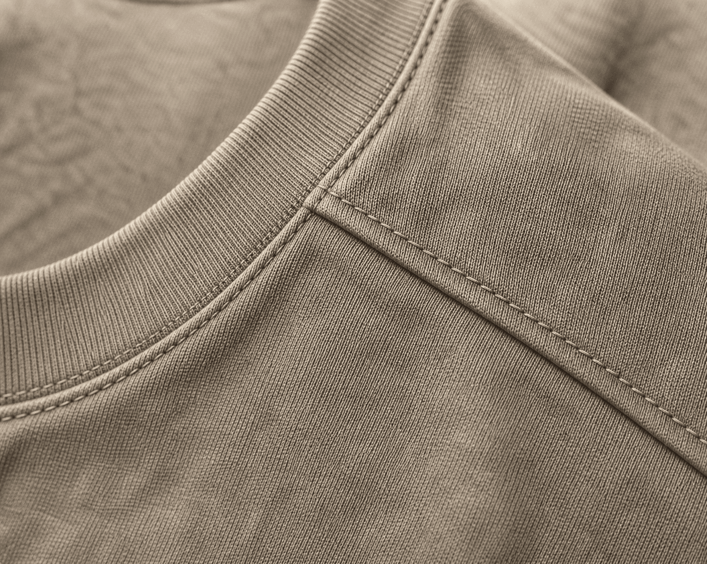 Macro detail of the DYRWOLF Stone T-Shirt fabric and stitching